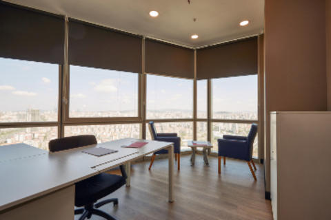 a dining room table in front of a window