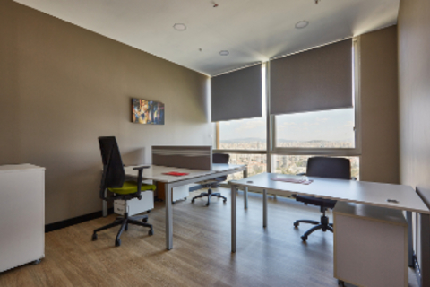a room filled with furniture and a large window