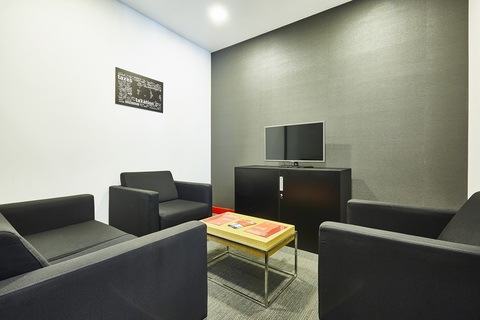 a living room with a couch and a chair