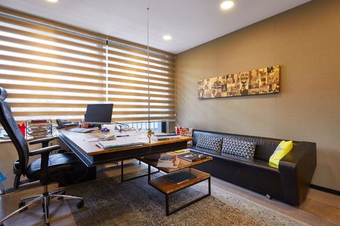 an office with a desk and chair in a room