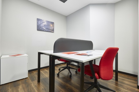 a chair sitting in front of a table