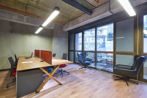 a room filled with furniture and a large window