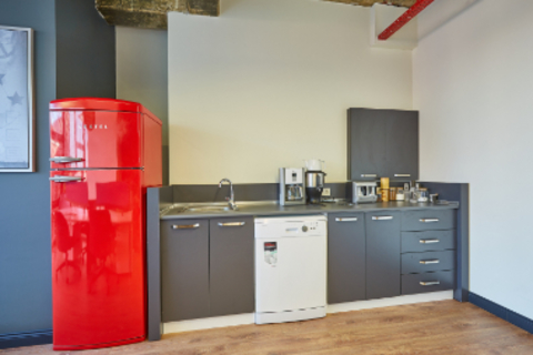 a stainless steel refrigerator in a kitchen