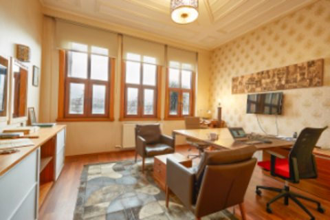 a living room filled with furniture and a large window
