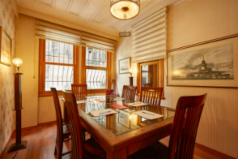 a dining room table in front of a window
