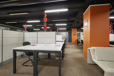 a large room with tables and chairs
