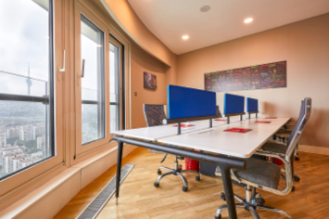 a room filled with furniture and a large window