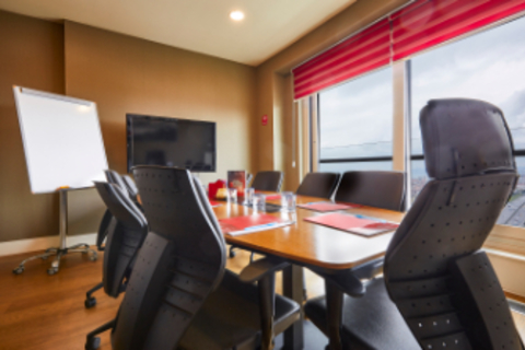 an office with a desk and chair in a room