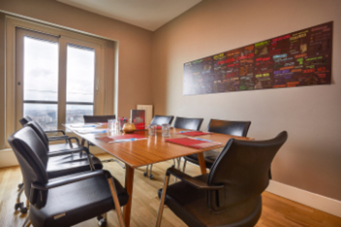 a dining room table in front of a window