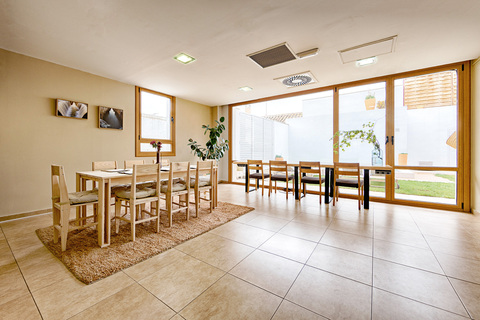 a room filled with furniture and a large window