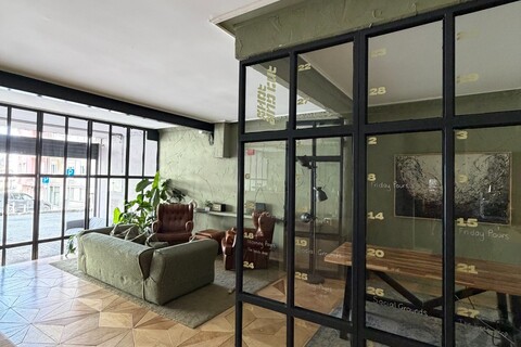 a room with glass walls and a table and chairs