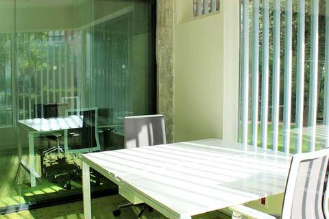 a dining room table in front of a window