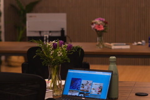 a person sitting at a table in a room