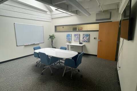 a room with a table and chairs