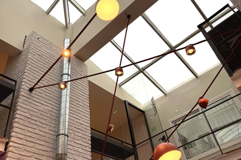 a traffic light hanging from the side of a building