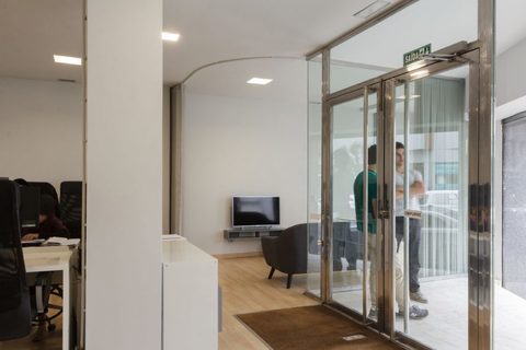 a room filled with furniture and a large window