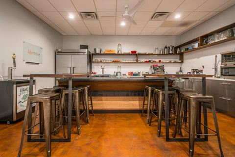 a kitchen with a table in a room