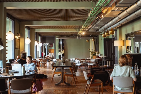 a room filled with furniture and a large window