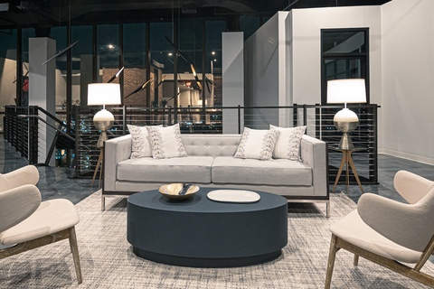 a living room filled with furniture and a table