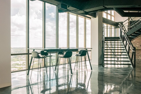 a room filled with furniture and a large window