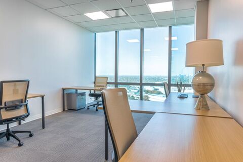 a room filled with furniture and a lamp