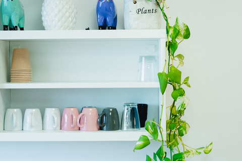 a vase of flowers on a shelf