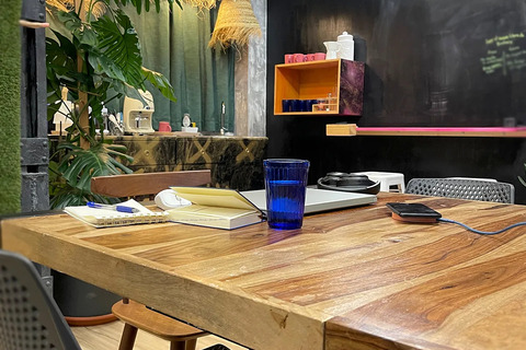 a desk with a laptop on a table