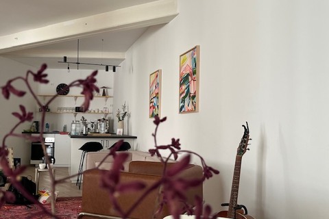 a room filled with furniture and a mirror