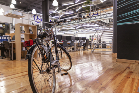 a bicycle parked on the side of a building