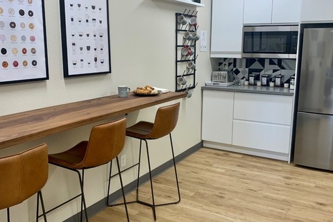 a kitchen with a table in a room