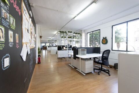 a room filled with furniture and a large window