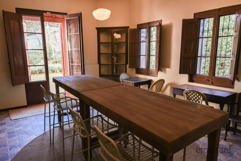 a dining room table in front of a window
