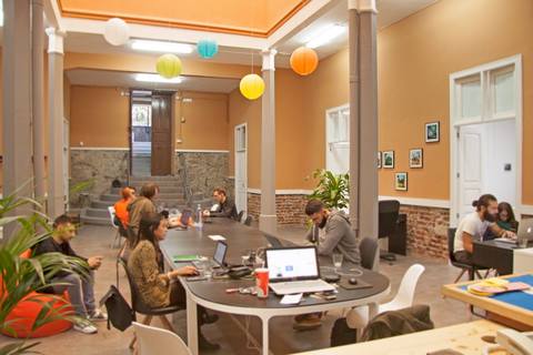 a group of people sitting at a table in a room