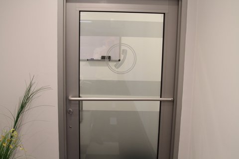 a white refrigerator freezer sitting next to a door