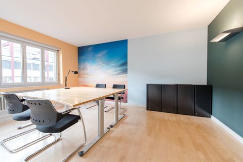 a kitchen with a wood floor in a room