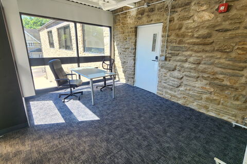 a room with a table and chairs