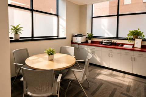 a room with a table and chairs