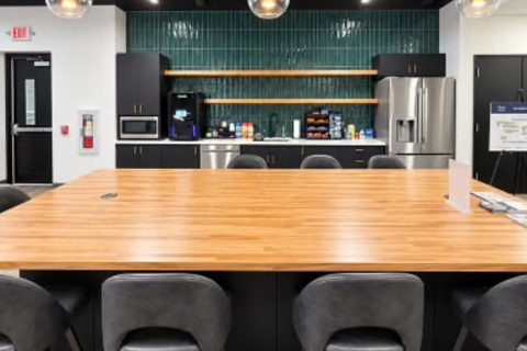 a conference room with a table and chairs