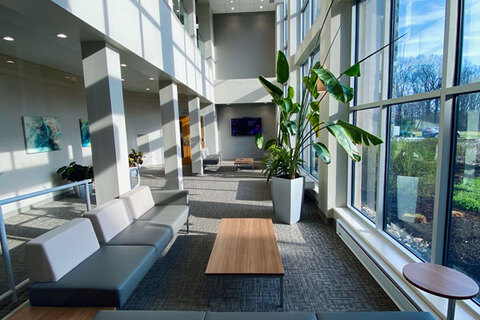 a room filled with furniture and a large window