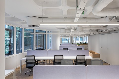 a room filled with furniture and a large window