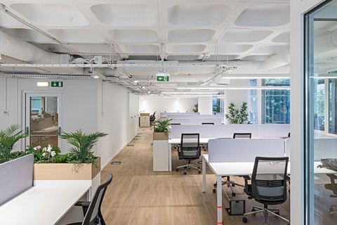 a room filled with furniture and a large window