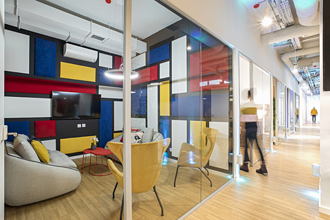 a room filled with furniture and a large window