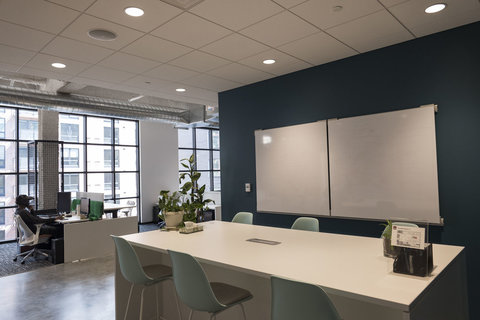 a room filled with furniture and a large window