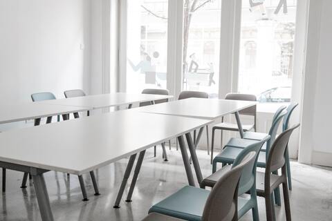 a dining room table in front of a window