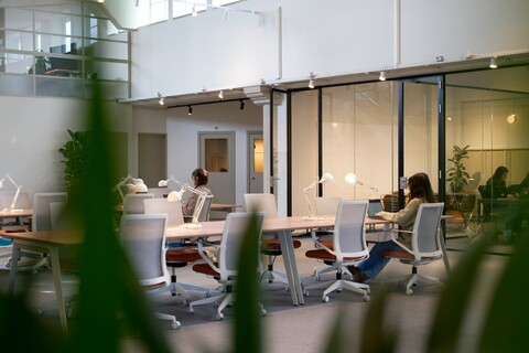 a person sitting at a table in a room