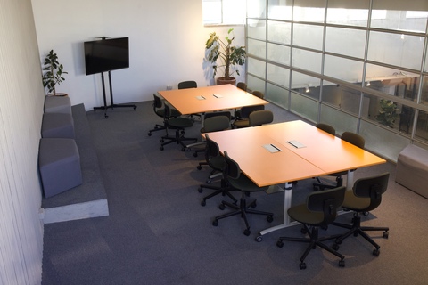 a room with a large table and chairs