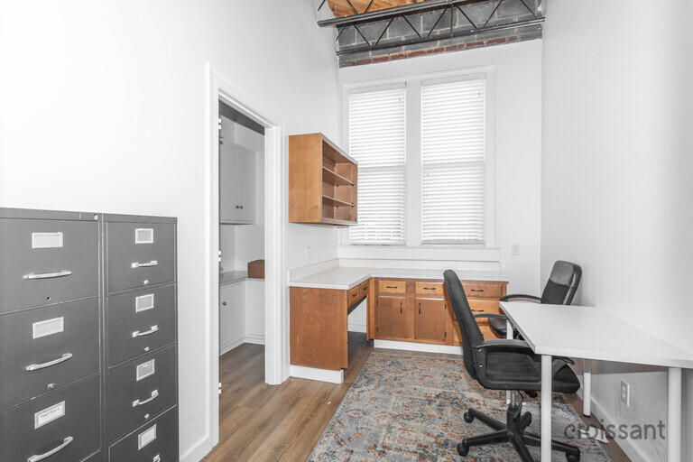 a room with a desk and chair