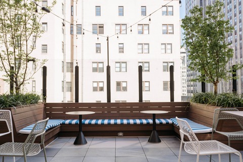 a chair sitting in front of a building