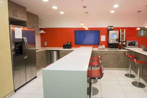 a kitchen with a table in a room