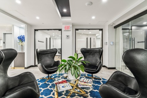 a living room with a leather chair